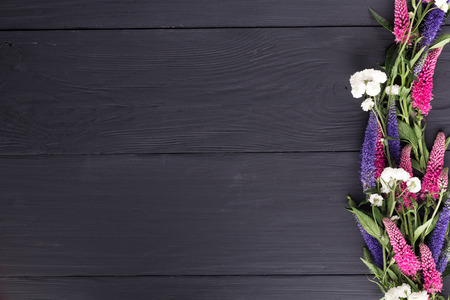 frame of flowers, background black boards, copyspaceの写真素材