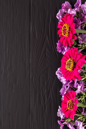 frame of flowers, background black boards, copyspaceの写真素材