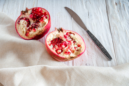 Sliced pomegranate on white background. Flat layの写真素材