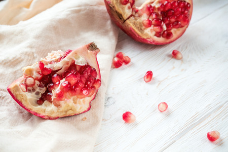 Sliced pomegranate on white background. Close upの写真素材