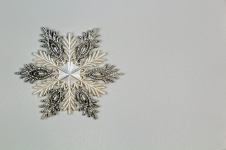 decorative snowflake on the wall with space for textの写真素材