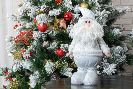 Christmas doll and decorations on Christmas tree close upの写真素材