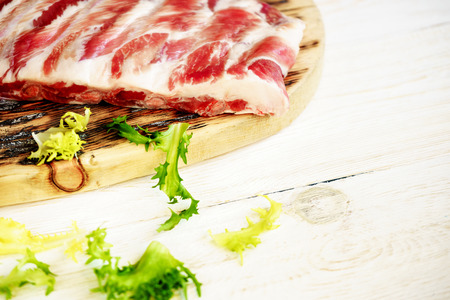 raw pork ribs on a cutting board, copyspaceの写真素材