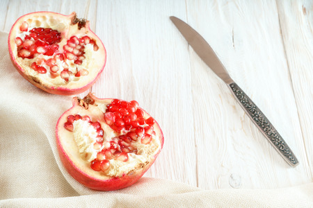 Sliced pomegranate on white background. Flat layの写真素材