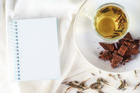 green teas, chocolates and note pad, top viewの写真素材