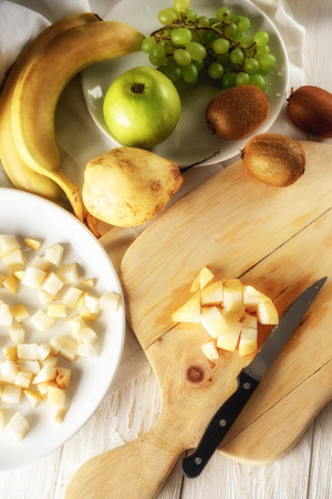 Ingredients for fruit salad. Cutting pears. Top viewの写真素材