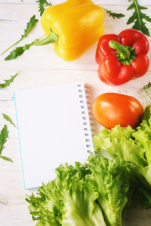 bell pepper, green salad and notepadの写真素材