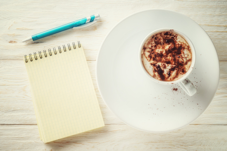 Sketchpad and a cup of hot cocoaの写真素材