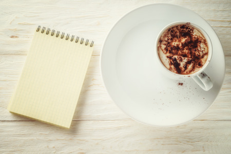 Sketchpad and a cup of hot cocoaの写真素材