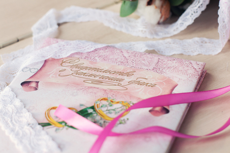 invitation on a wedding and pink tapesの写真素材