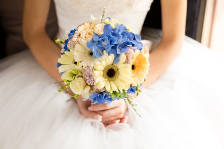 bridal bouquet of blue color in handsの写真素材