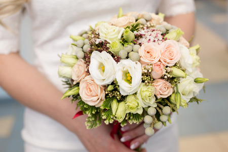 bridal bouquet of pink color in handsの写真素材