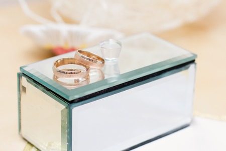 gold wedding rings and mirror casketの写真素材