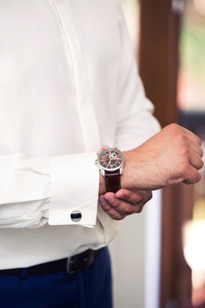 stylish watch on a hand at the manの写真素材