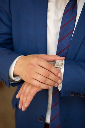 stylish watch on a hand at the man