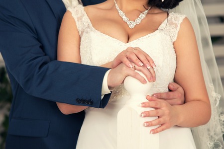 passionate embraces of the groom and bride