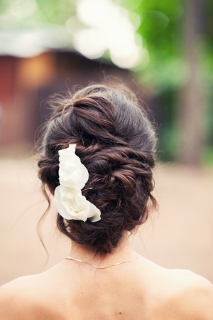 white roses in the bride's hair