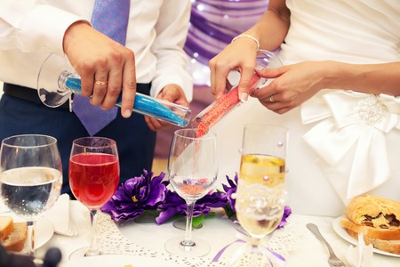 Newlyweds during sand ceremony at a weddingの写真素材