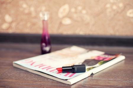 women's lipstick of pink color and magazine of fashionの写真素材