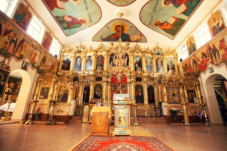 Interior of Orthodox Christian church - altar, iconostasis, and beautiful icons, frescoes in natural...