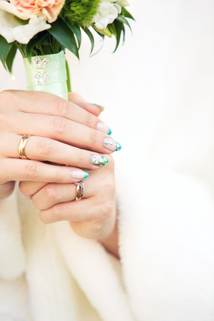 Beautiful wedding bouquet of statice in hands of the bride, manicureの写真素材