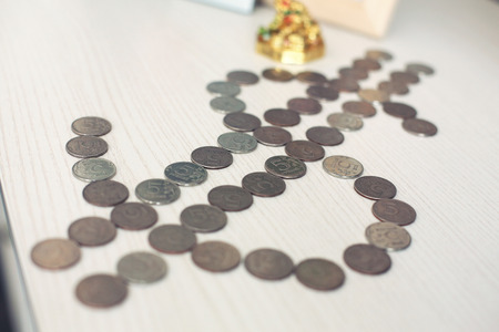 russian roubles coins on banknotes of dollars