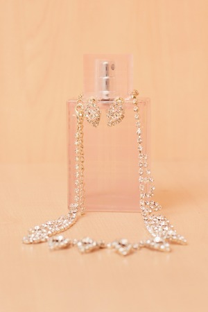 Tenderness lingerie with perfume and jewelry in pink colorの写真素材