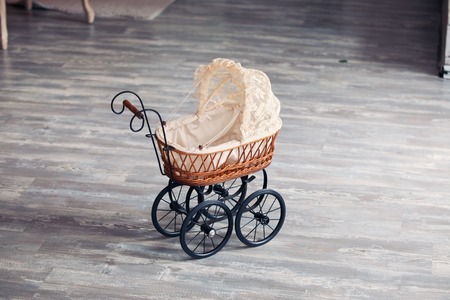 Vintage toy carriage in retro interior. childhoodの写真素材