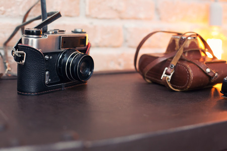 Close up of a vintage film camera with a leather caseの写真素材