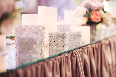 Luxury fashion wedding decoration wedding, wedding table, restaurant. Candles and glasses, glareの写真素材
