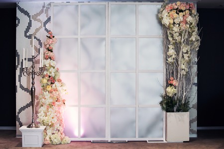 Wall floral decorations of roses and hydrangeas in a restaurant Luxury floral compositionsの写真素材