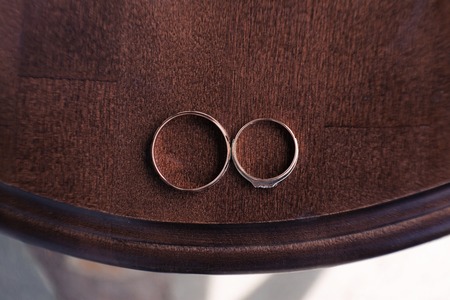 Wedding Rings on wooden backgroundの写真素材