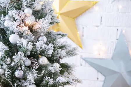 Christmas silver ball on the Christmas tree. New Year's toy.の写真素材