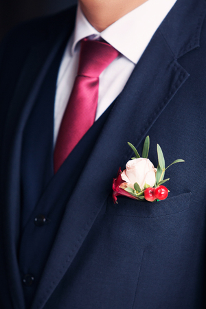 stylish buttonhole of the groom from roseの写真素材