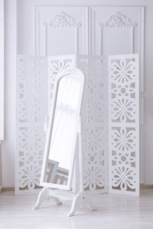 white mirror in the light room with a classical interiorの写真素材