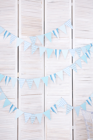 White brick wall decorated by colorful cartoon flag in children bedroomの写真素材