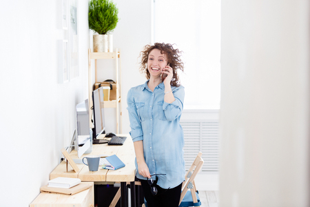 Young employee of company is happy to be promoted at work.の写真素材