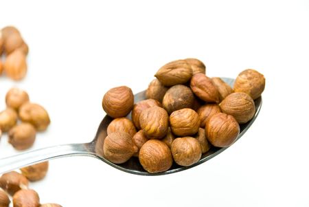 raw hazelnuts - isolated on whiteの写真素材