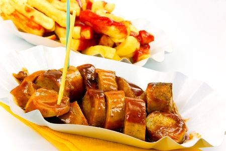 Frying sausage,french,fries, with ketchup-isolated on white.の写真素材