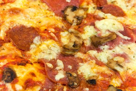 A pizza with cheese,salami - slicesの写真素材