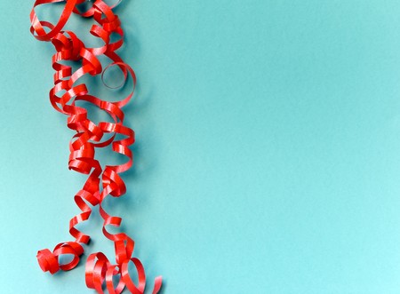 red tinsel on the green backgroundの写真素材