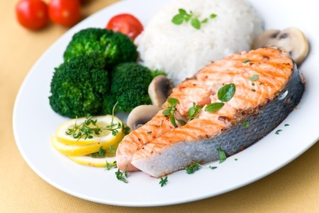 grilled salmon with broccoli rice and tomatoの写真素材