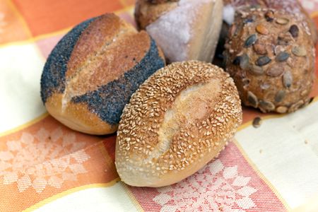 Many buns with sesame seeds , macro shot.