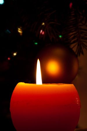 Christmas candles and baubles on darkの写真素材