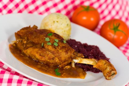 Roasted leg of duck, red cabbage and potato dumplings の写真素材