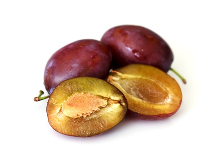Red plum fruit isolated on white background の写真素材