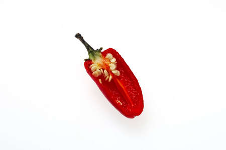 Red Bullet Chilli, sliced lengthways, showing seeds - isolated on whiteの写真素材