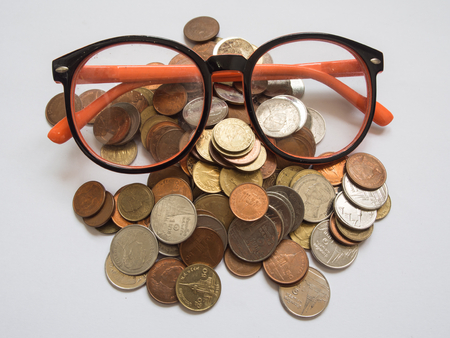 Eyeglasses on baht coinsBackgrounds.の写真素材