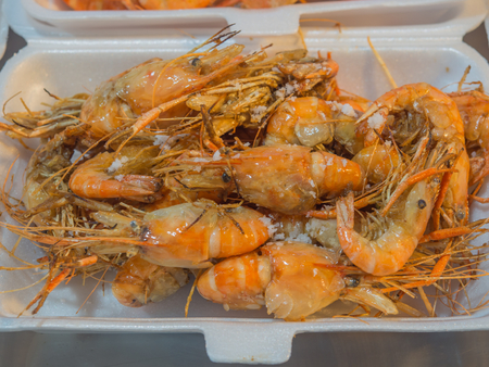 Fresh Grilled Shrimp Baked salt Placed in a foam box for sale in the market.Delicious Seafood.の写真素材