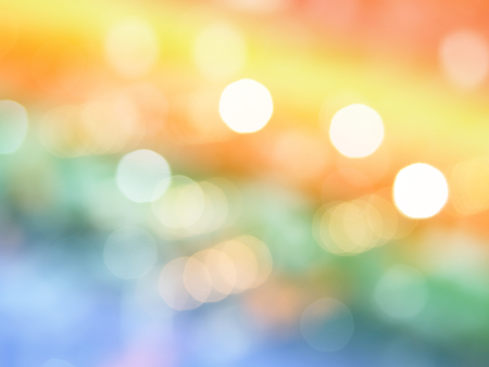 Abstract photo of light burst and glitter bokeh lights background. Image is blurred and made with colorful filters.の写真素材